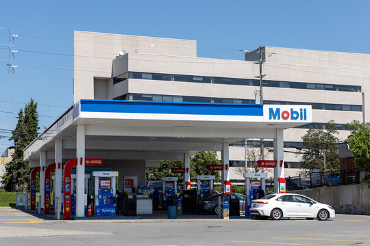 Ottawa, Canada - July 30, 2026: Mobil gas station canopy and fuel pumps