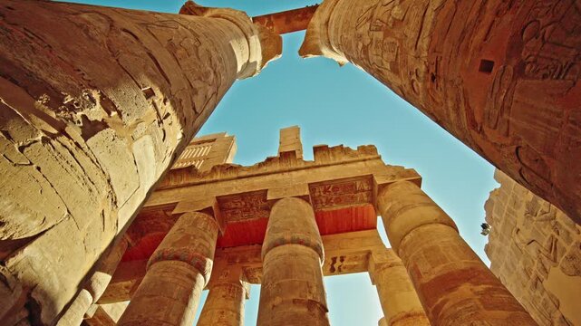 Low-Angle View of Painted Ceiling and Carved Columns at Karnak Temple