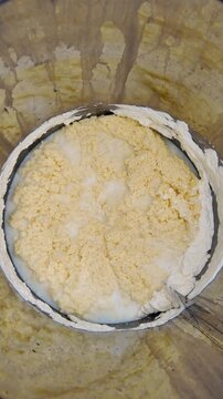 Butter Separating From Buttermilk During Churning Process