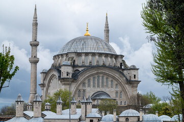 Fototapeta premium Ottoman mosque with a cloudy sky at evening
