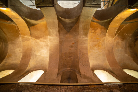 Ancient vaulted chamber with weathered frescoes
