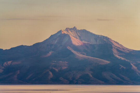 Tunupa Volcano rising above Salar de Uyuni salt flat Bolivia 2024