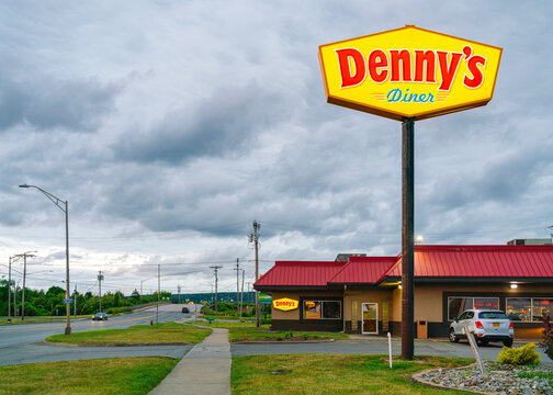 Utica, NY - Jul 22, 2026: Cloudy dusk view of Denny&rsquo;s Diner located on Genesee Street