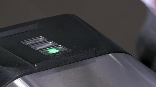 A customer seamlessly scans an item at a sleek checkout terminal. The scanner lights up green, confirming the purchase. The cashier acknowledges with a smile, creating a friendly shopping experience.