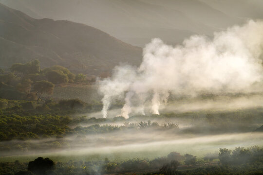 Agricultural burning and smoke rising in Ica Valley, Peru 2025