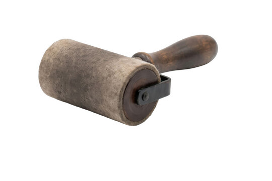 Vintage wallpaper pasting roller with wooden handle and felt cylinder