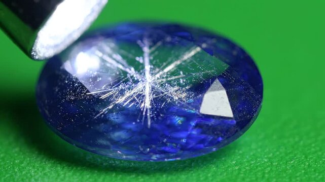 Natural Blue Star Sapphire Gemstone Showing Asterism Under Moving Light