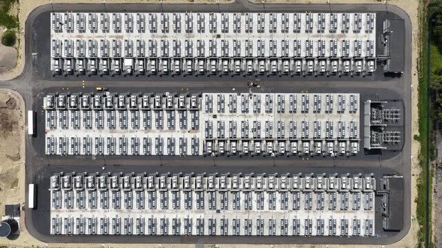 Aerial top down view of electric vehicle charging station