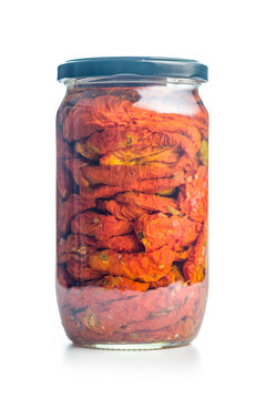Jar Of Sun-Dried Tomatoes Preserved In Oil Close-Up On White Background