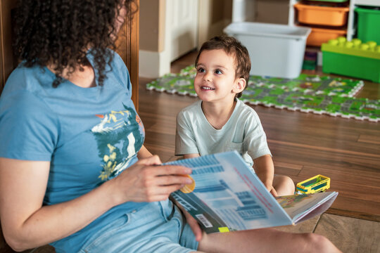 Parent Reading With Young Child At Home &mdash; Family Storytime, Bonding And Early Learning In Playroom
