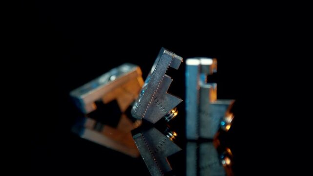 Precision machined metal parts with threads on reflective black