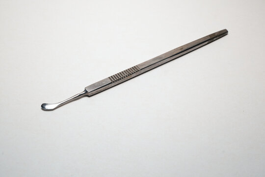 Basra, Iraq - August 14, 2026: Stainless steel corneal scraper surgical instrument for PRK su