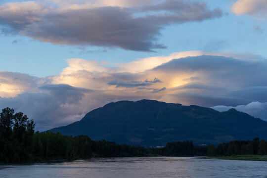 Sunset Clouds Over Mountain River Near Chilliwack, BC Canada &mdash; Scenic Evening Landscape