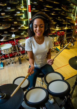 Woman Playing Electronic Drums.