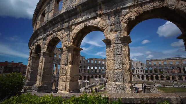 Historic Roman amphitheater of Pula in Istria Croatia on a sunny summer day with blue sky, wide shot.
