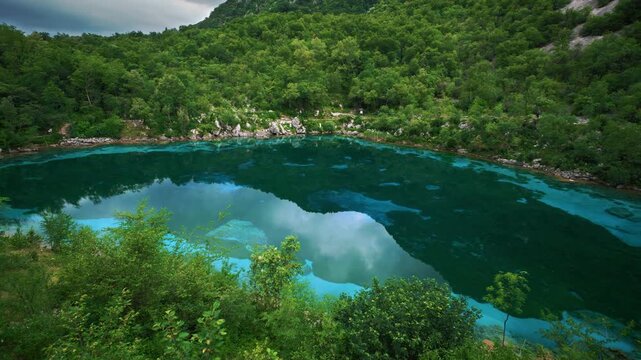 Scenic view of the unique turquoise alpine lake Lago Cornino near the Tagliamento river valley, Italy