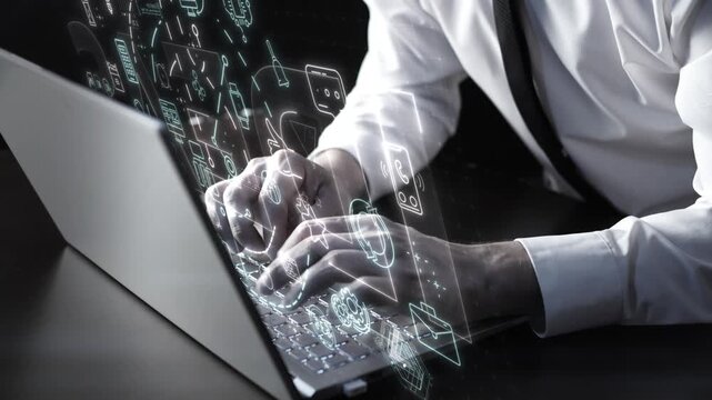 Businessman working on laptop with digital communication icons overlay