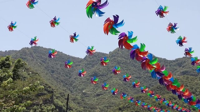 Rows of little lanterns hanging on a street in a magical town in Mexico