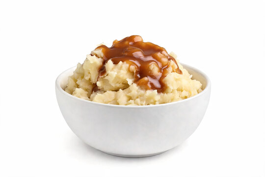 Bowl of mashed potatoes with brown gravy isolated on white background