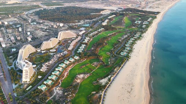 Luxury beach resort and golf course at sunrise from aerial view in Vietnam FLC Nhon Ly