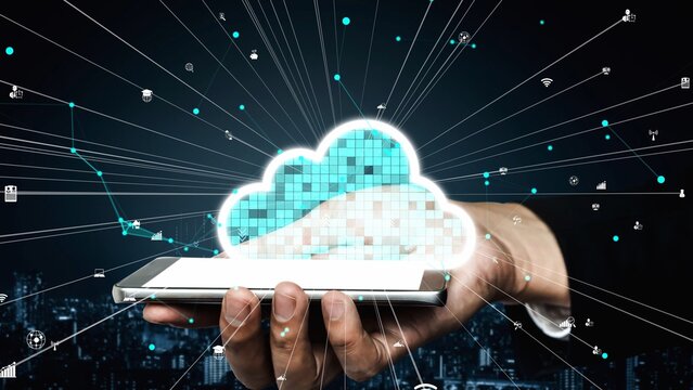 A creative representation of cloud computing showing a hand holding a smartphone with digital cloud symbols surrounded by network connections against a dark city backdrop. Xenic