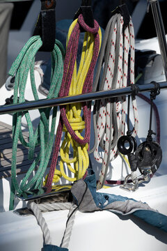 Sailing boats at a marina on a sunny day. Detail of Ropes and pullies.