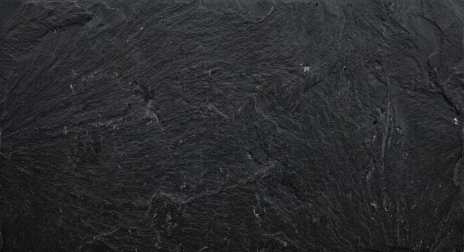 Textura de fotograma completo de piedra de pizarra negra natural con veteado sutil y acabado mate.