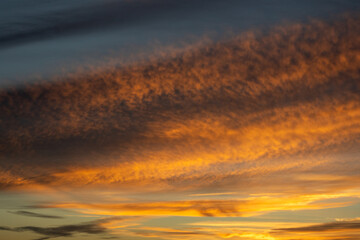 Fototapeta premium Dramatic Golden Hour Sky With Textured Clouds
