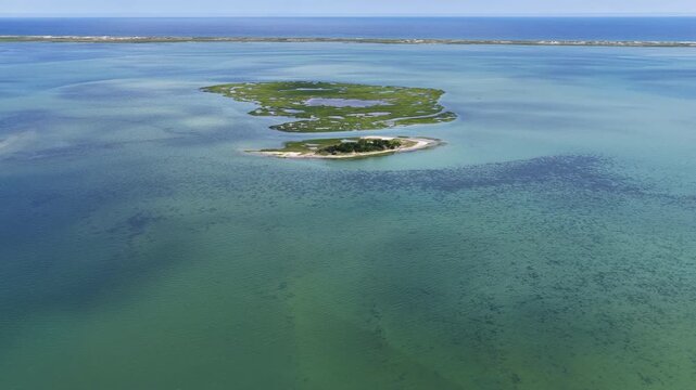Narrow channels meander through a salt marsh called Sipson Island Meadow in Pleasant Bay, Cape Cod. Marshes provide critical habitat for many birds, fish, and invertebrates to feed, mate, and nest.