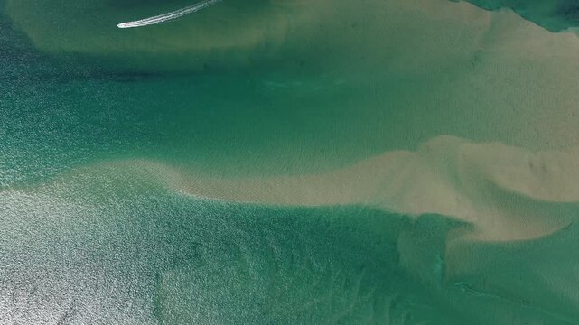 The Atlantic Ocean washes against the beautiful coast of Chatham on Cape Cod, Massachusetts. This outer Cape is a popular and scenic east coast vacation destination during summer months.