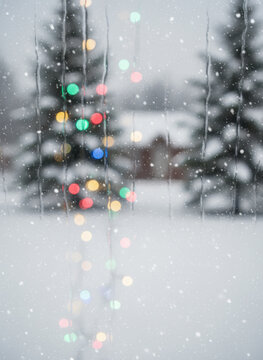 Snowfall, Christmas light, winter landscape, bokeh background, evergreen tree, colorful decoration Christmas Concept