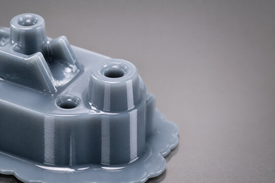 Macro view of glossy freshly printed resin part