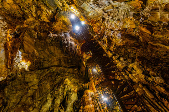 Moaning Caverns formations glow illuminated in darkness
