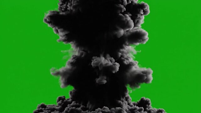 Black smoke explosion billowing on green screen background.