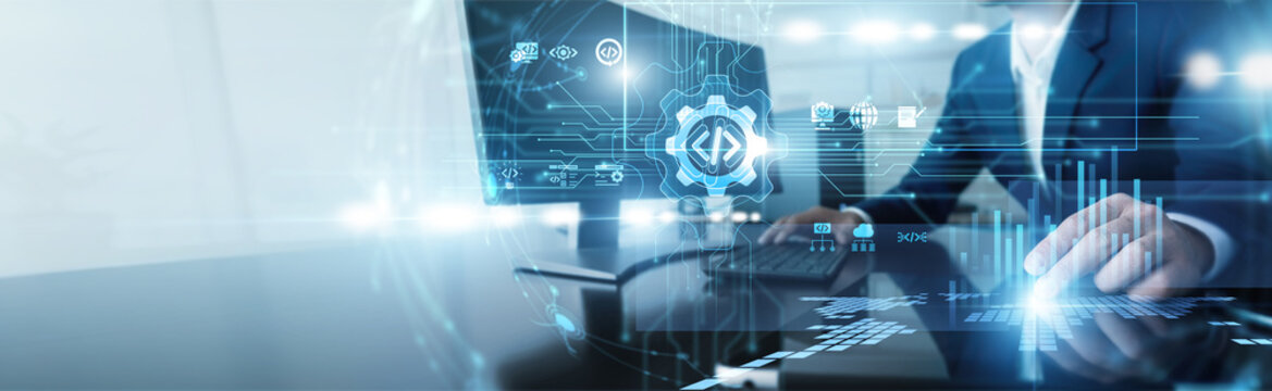 Computer programmer working on computer in software development. Expert engineer writing clean code and debugging applications to build robust digital solutions for modern enterprises.