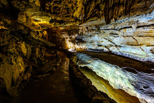 Crystal Cave formations glow blue and gold