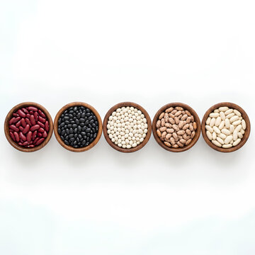 Five wooden bowls with assorted dried beans variety.