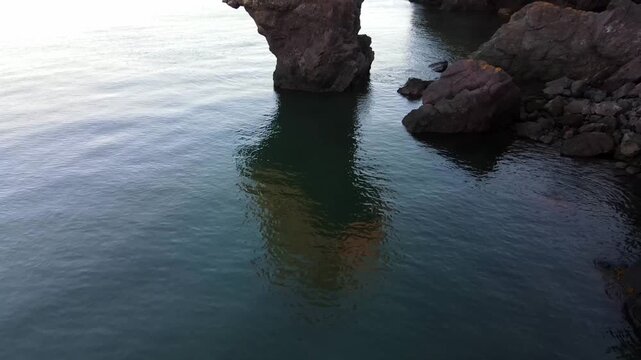 Iconic Anvil Rock sea stack rises dramatically along the Bay of Fundy shoreline at Quaco Head New Brunswick