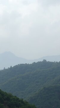 Misty Mountainside Landscape with Green Hills.