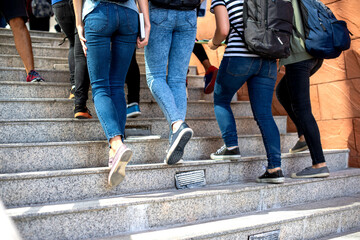 Obraz premium Students ascending outdoor stairs photo