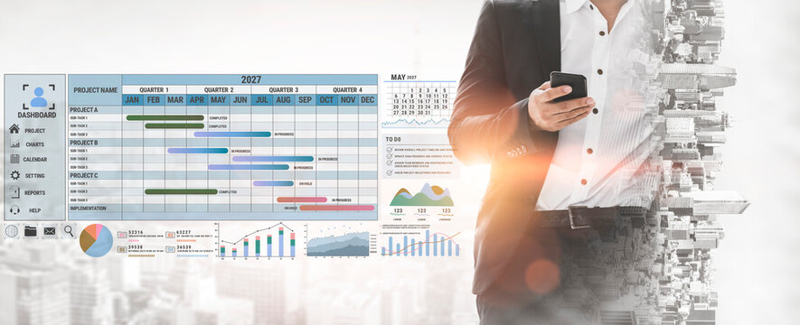 Business professional using smartphone for project management with digital dashboard displaying graphs, charts, and timelines in modern office setting Fluxor.