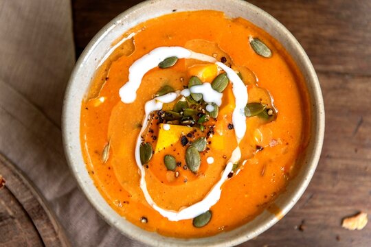 Creamy pumpkin soup with seeds.