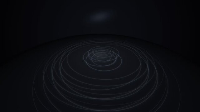 Abstract futuristic glowing circular light rings animating on pitch black background, high angle perspective view creating a subtle, minimal digital technology data visualization scene.