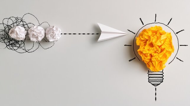 A paper airplane flies from crumpled paper balls toward a yellow light bulb made of crumpled paper, symbolizing creativity and idea generation.