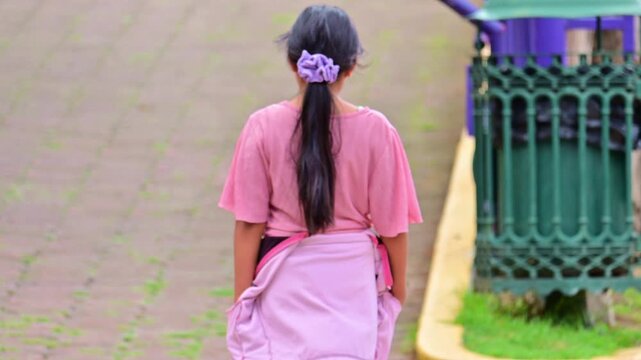 Latina girl walking slowly away.mp4