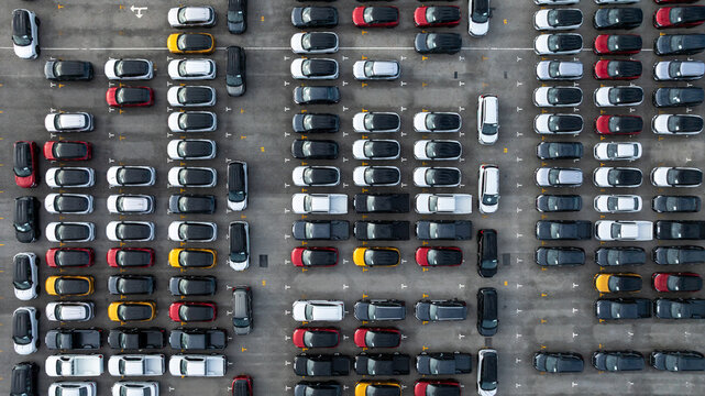 Aerial view new car lined up, Automobile automotive car parking lot commercial business industry,  Port of import export business logistic dealership, New cars global business logistic import export.