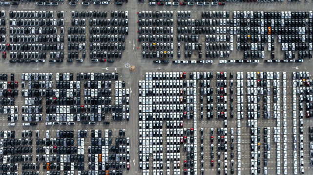 Aerial view new car lined up, Automobile automotive car parking lot commercial business industry,  Port of import export business logistic dealership, New cars global business logistic import export.