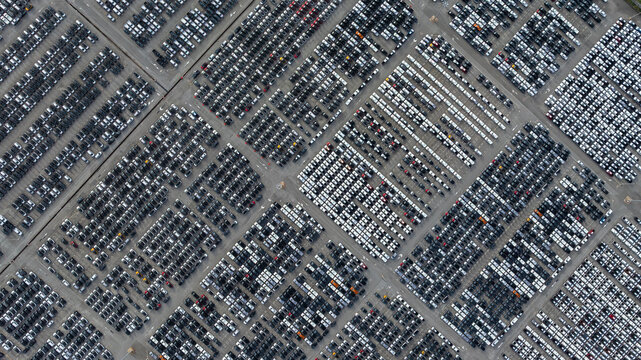 Aerial view new car lined up, Automobile automotive car parking lot commercial business industry,  Port of import export business logistic dealership, New cars global business logistic import export.