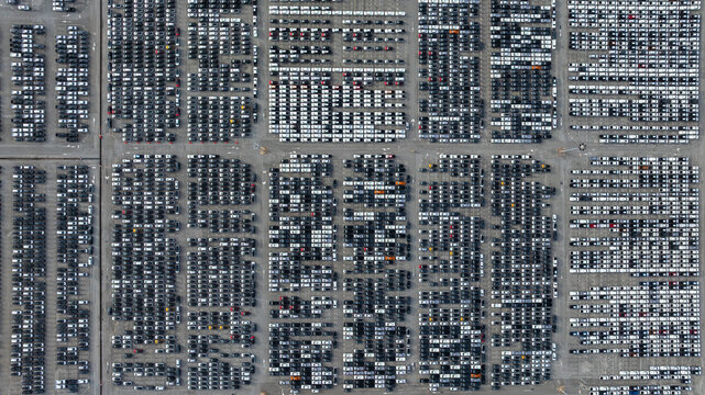 Aerial view new car lined up, Automobile automotive car parking lot commercial business industry,  Port of import export business logistic dealership, New cars global business logistic import export.