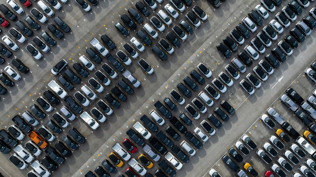 Aerial view new car lined up, Automobile automotive car parking lot commercial business industry,  Port of import export business logistic dealership, New cars global business logistic import export.